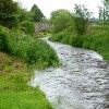 The view down Kirkgunzeon Lane to the bridge